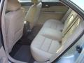 The back seats of a Ford Fusion Hybrid in Fords medium light stone color.