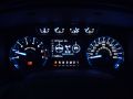 Instruments and gauge assembly at night with running lights on, 2011 Ford F150